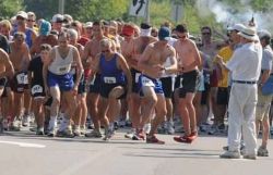 Bill Luti fires the gun to start the race
