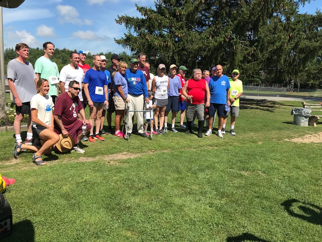 Coach Luti with some of his alumni runners from CHS in 2018